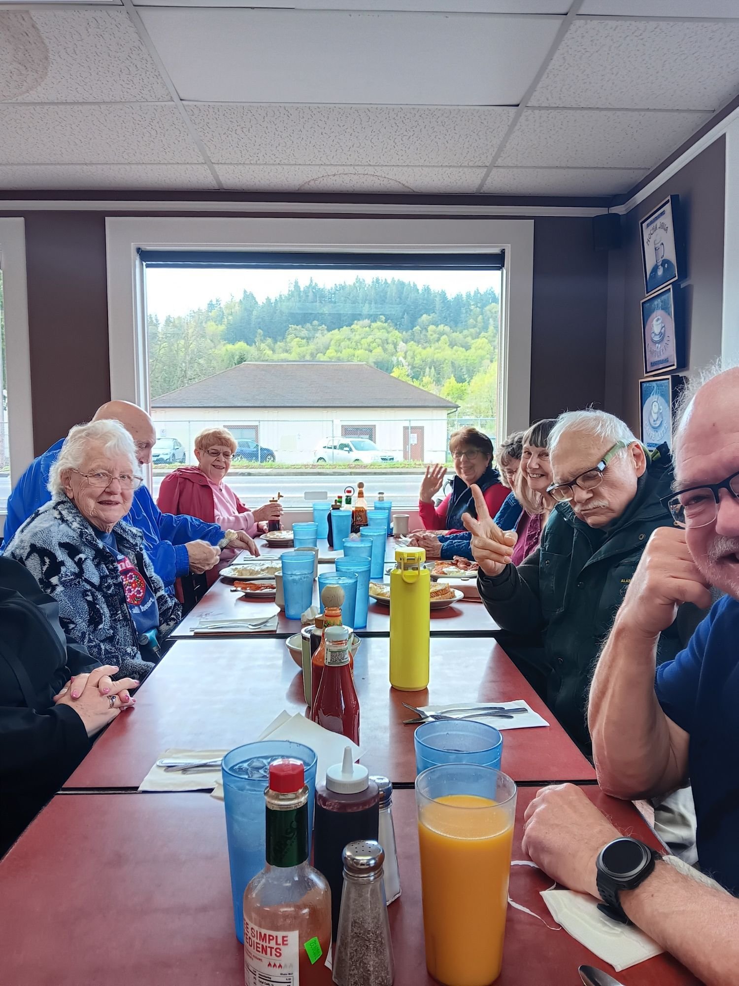 Residents of the tight-knit and welcoming Fairlawn Living Retirement Community enjoy a breakfast outing to connect and converse with one another, building a positive social bond.-1